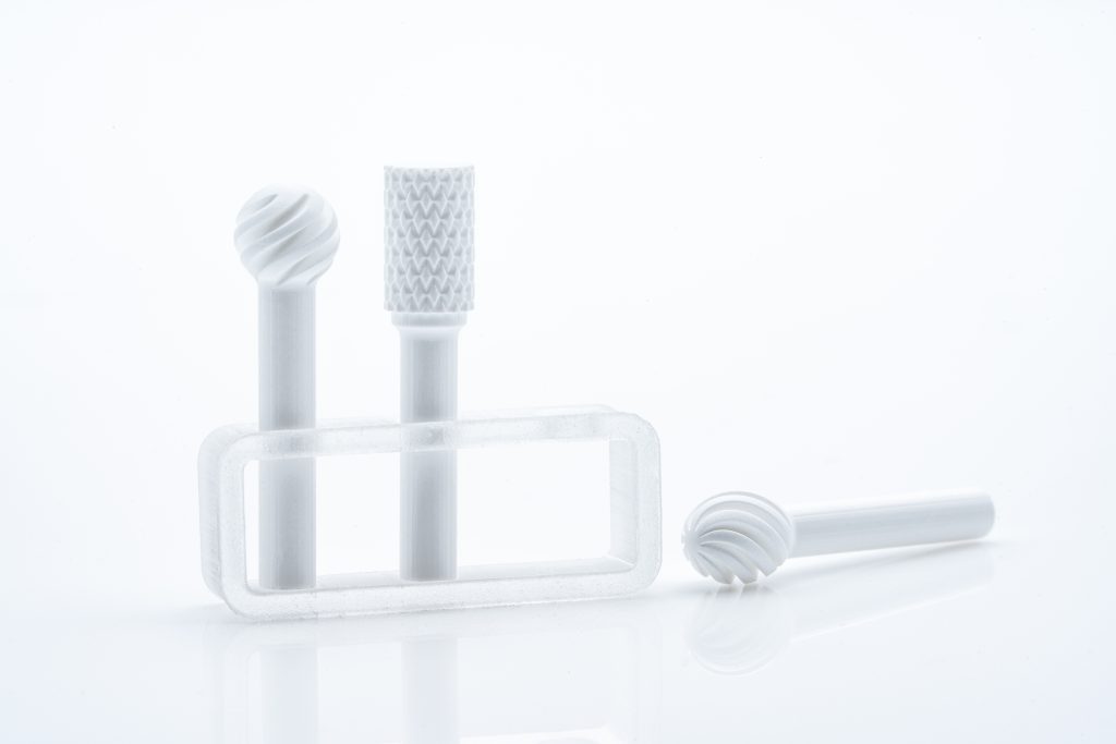 These dental burs made of alumina-toughened Zirconia (ATZ) perfectly illustrate the limitless possibilities opened up via ceramic 3D printing. Image via Lithoz.