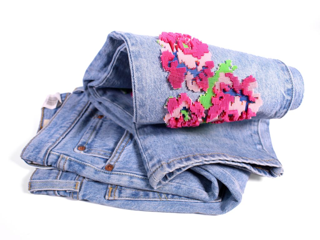 Fashion design 3D printed onto jeans Stratasys' Direct-to-Garment technology. Photo via Stratasys