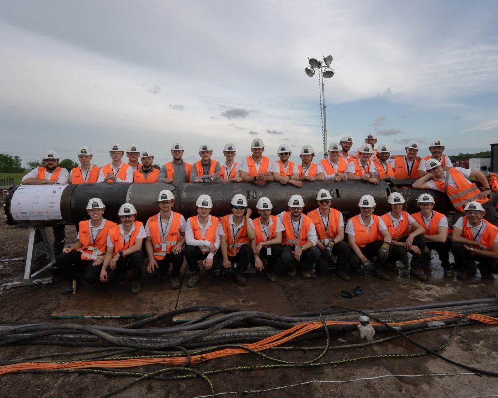 The Swissloop Tunneling team with the groundhog Beta. Photo via Swissloop Tunneling.