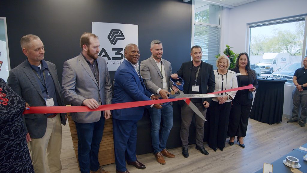 A3D Manufacturing Director of Sales Chad Wigert; Director of Manufacturing Taylor Moore; Phoenix City Councilman Kevin Robinson; A3D Manufacturing VP of Operations Jacob Moss; Senior Vice President Jon Toews; Greater Phoenix Chamber VP of Strategic Member Engagement Debbie Drotar; and Director of Strategic Member Engagement Jenifer Kocher at the A3D Manufacturing ribbon cutting ceremony on May 30. Photo via A3D Manufacturing.