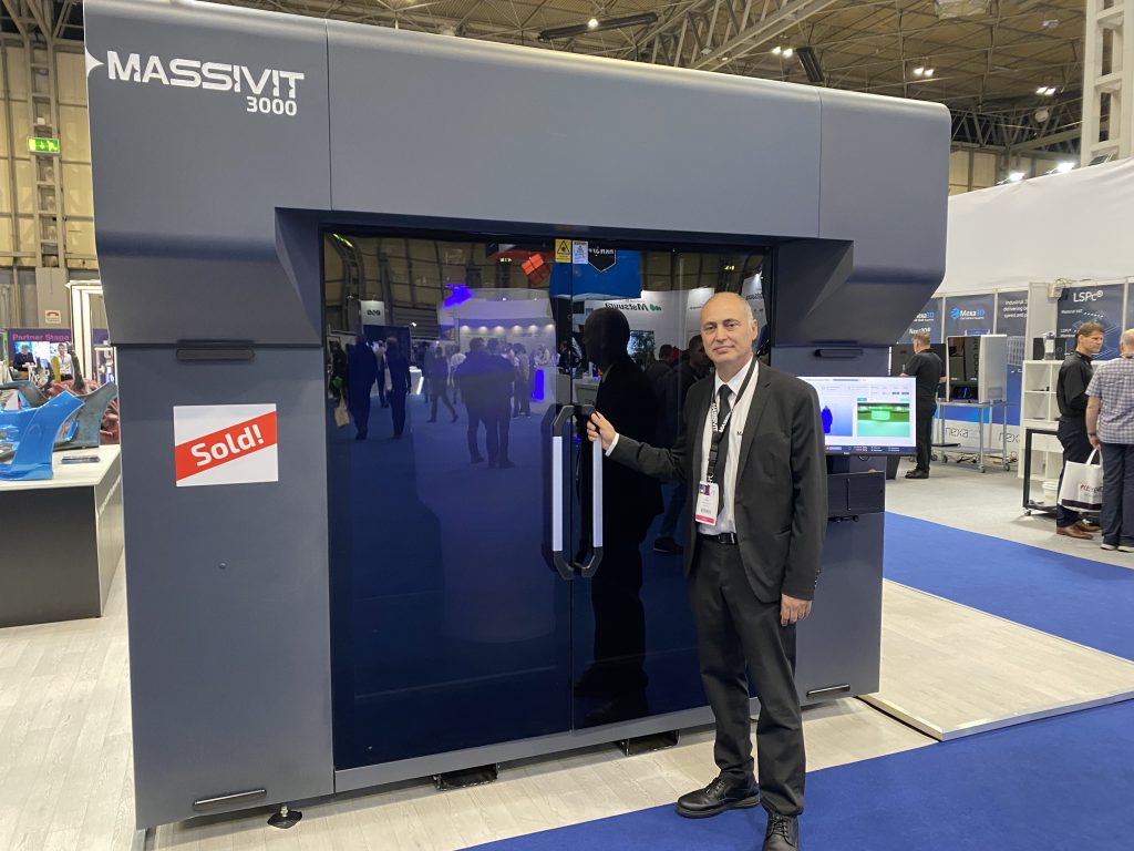 Avi Cohen, VP Sales and Marketing at Massivit, and the new Massivit 3000. Photo by 3D Printing Industry.