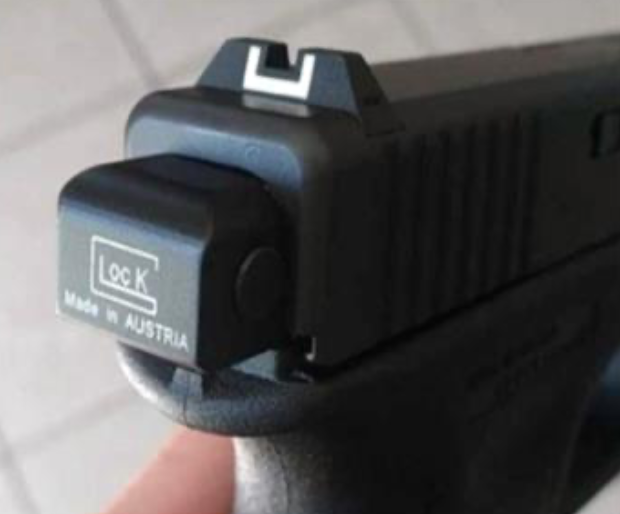 A Glock handgun fitted with an auto sear component. Photo via City of Chicago vs Glock lawsuit.