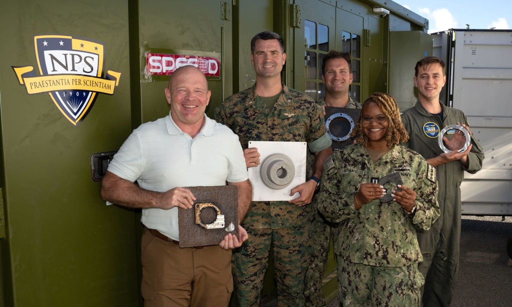 The CAMRE team with the XSPEE3D 3D printer at RIMPAC. Photo via the Naval Postgraduate School.