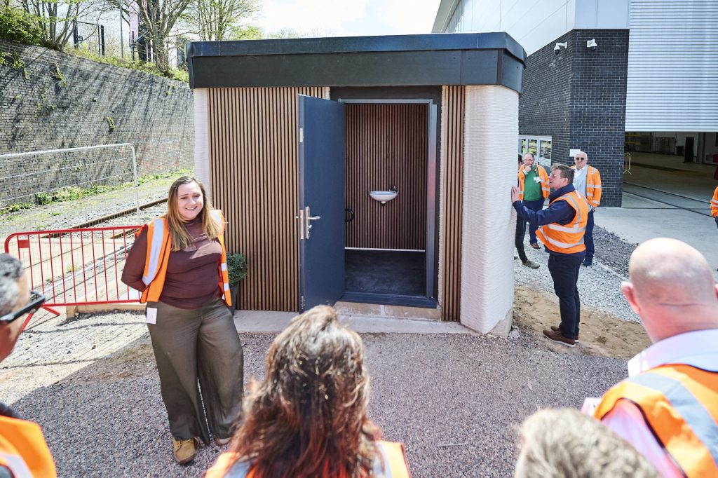 Unveiling the 3D printed toilet pod. Photo via Changemaker 3D.