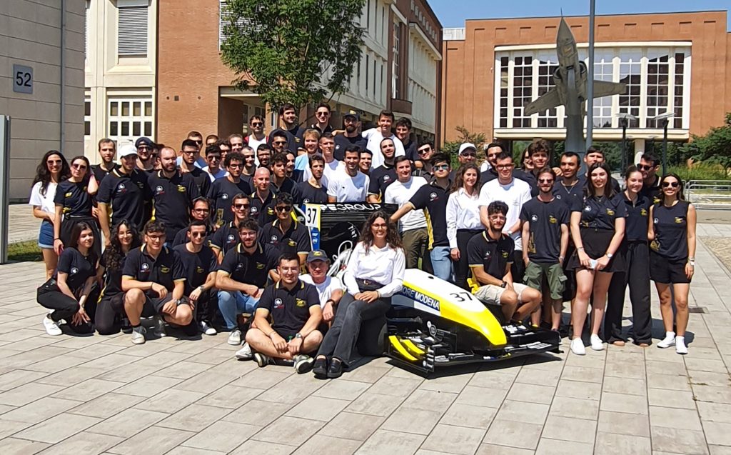 The MoRe Modena Racing team with the M24-LH race car. Photo via CRP Technology