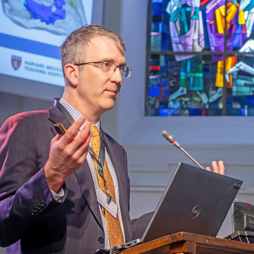Dr. David Hoganson speaking at the Materialise 3D Printing in Hospitals Forum 2025. Photo via Materialise.