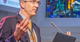 Dr. David Hoganson speaking at the Materialise 3D Printing in Hospitals Forum 2025. Photo via Materialise.