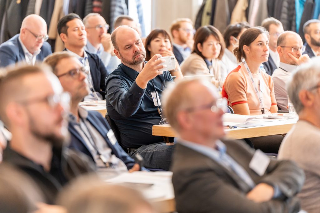 Attendees engage with expert talks during a technical session at AM Ceramics. Photo via Lithoz.