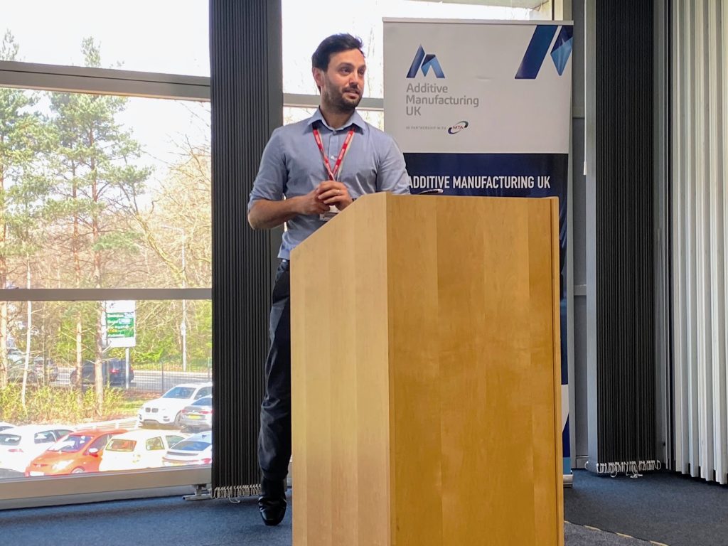Josh Dugdale speaking at the AMUK Members Forum in Manchester. Photo by 3D Printing Industry.