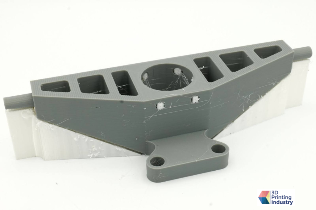 3D printed trolley bracket prototype. Photos by 3D Printing Industry.