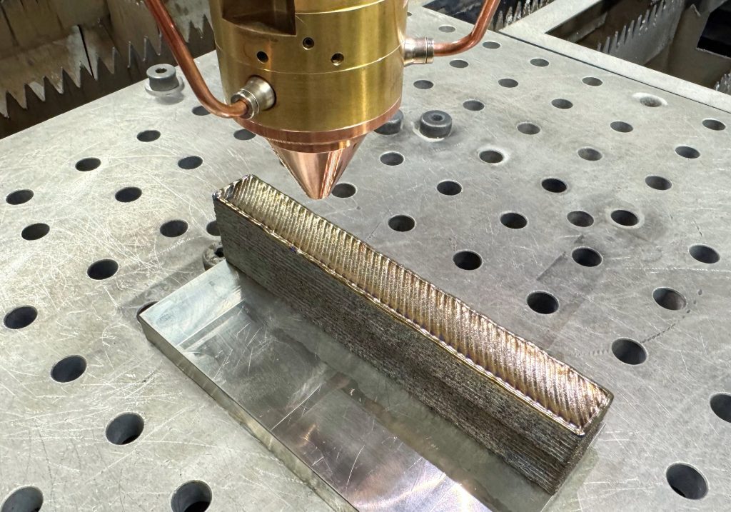 A sample of the new stronger, cheaper 3D printed titanium. Photo via Michael Quin, RMIT University.