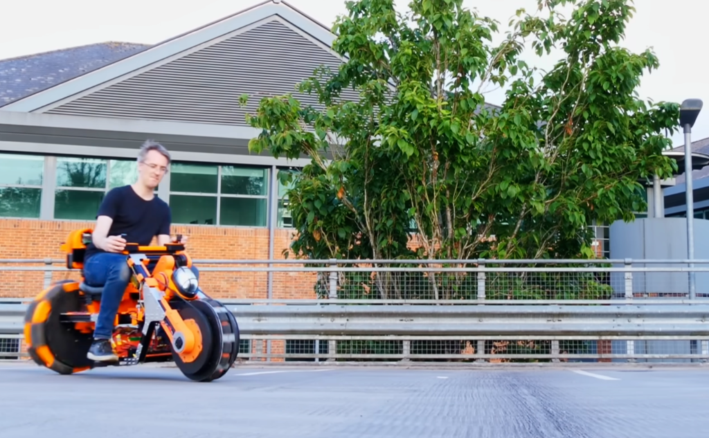 James Bruton test-rides the completed omnidirectional bike. Photo via James Bruton.
