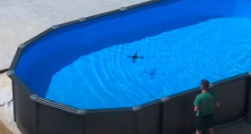 The hybrid drone gets a swim in the pool. Photo via Andrei Copaci/Aalborg University.