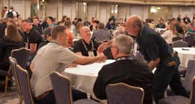 First-time attendees gather at the New Member Welcome to kick-start engagement, networking, and learning. Photo via AMUG.