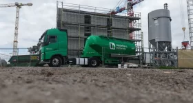 Construction site of the DREIHAUS 3D printed housing project in Heidelberg, featuring Heidelberg Materials equipment. Photo via Agg-Net.