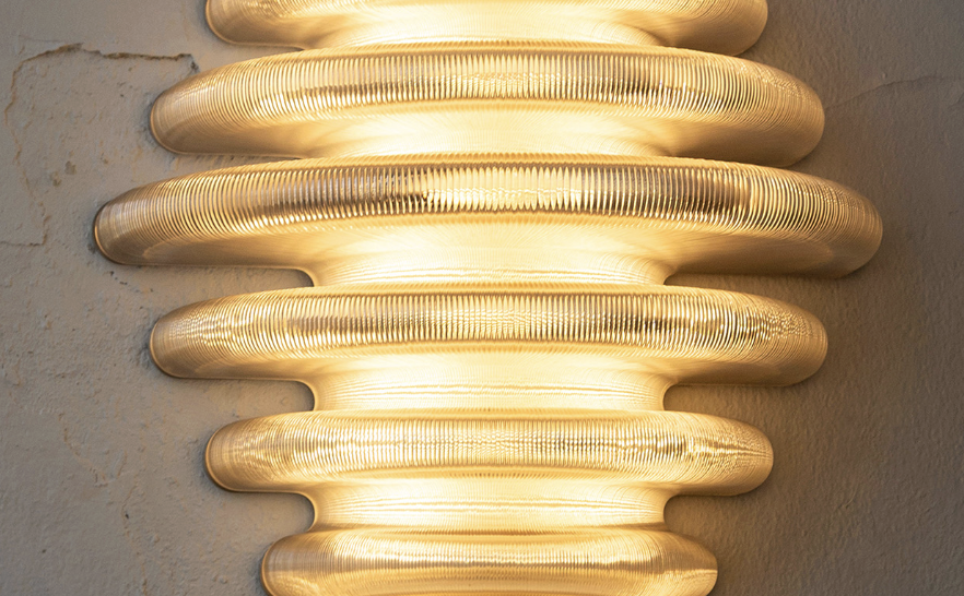 The Hive Wall Lamp. Photo via Haarlem's 3D Print Gallery.