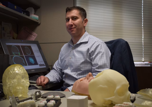 Dr. Peter Liacouras, director of services at 3D MAC, designed the 3D printed titanium cranial plate. Photo via Walter Reed National Military Medical Center.