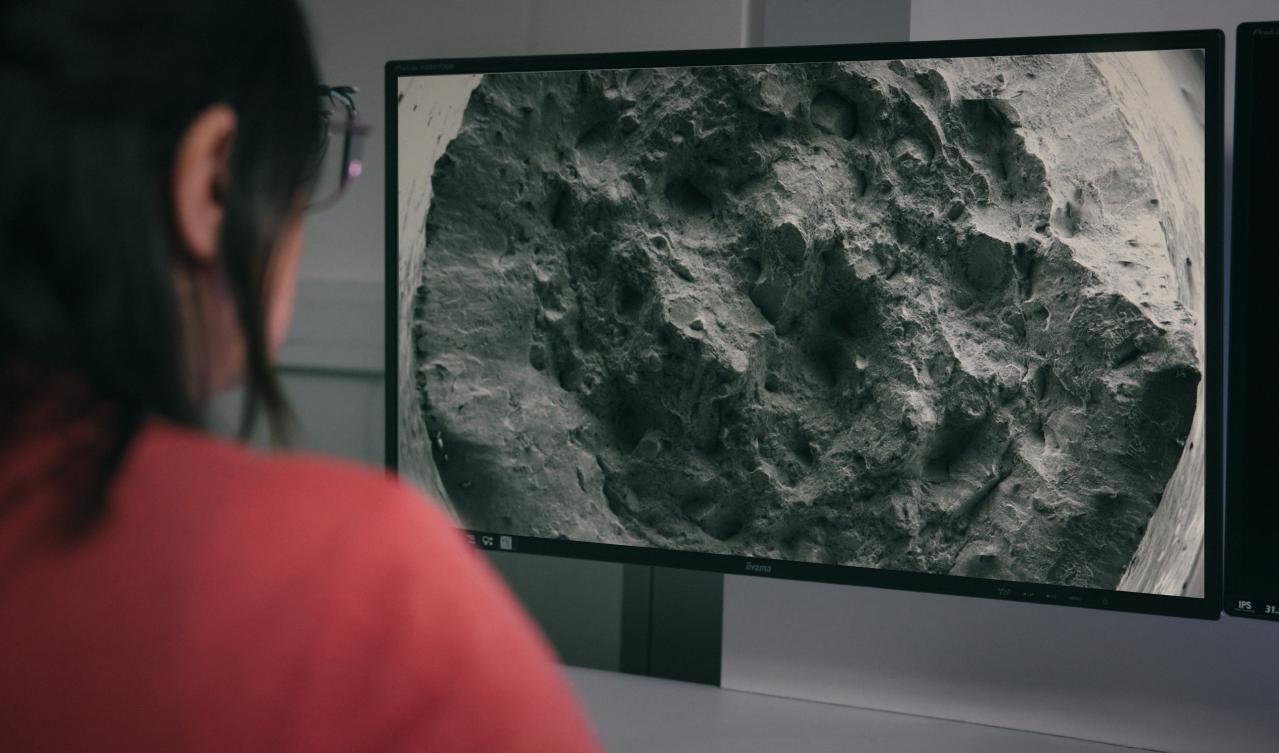 Scanning electron microscopy of metal powder at EOS. Photo via EOS.